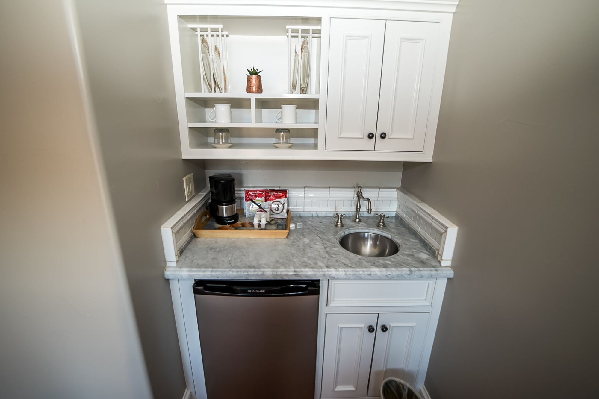 Small wet bar with sink and fridge