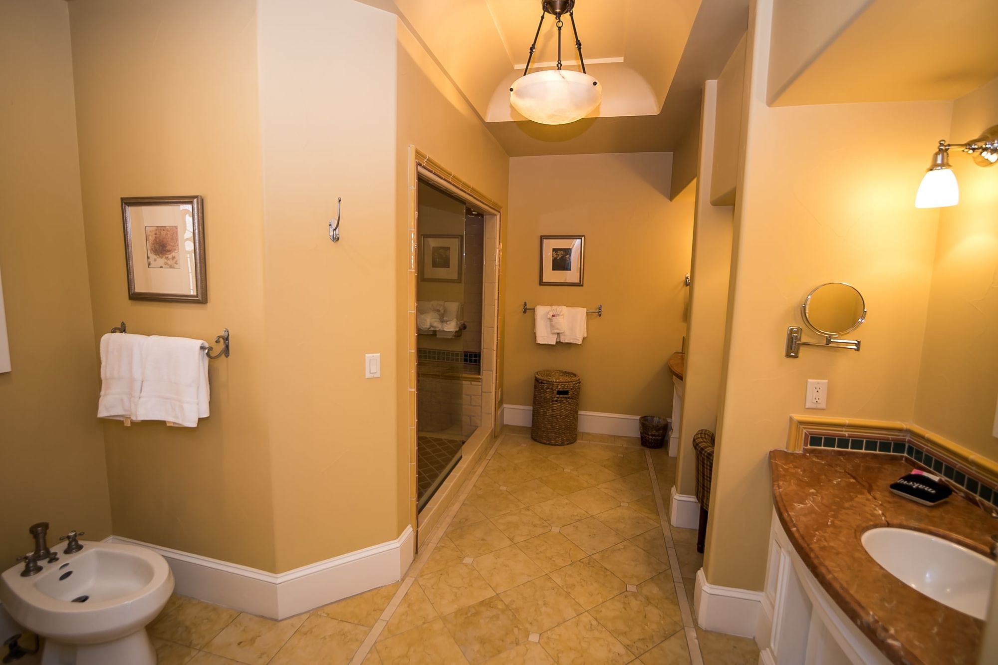 Bathroom with bidet to left and vanity to the right